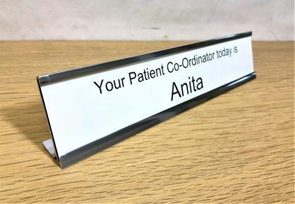 Desk signs with white laser engraved durable plastic inserts