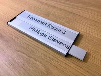 Twin interchangeable sliding door signs
