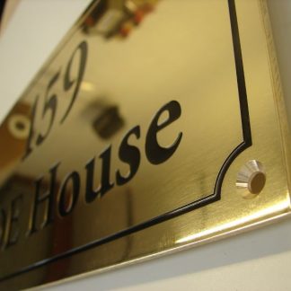 brass sign for exterior building