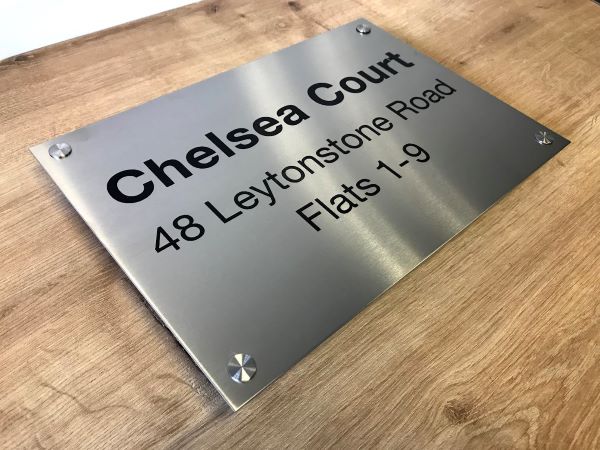 chelsea-court-marine-grade-brushed-stainless-steel-etched-sign-with-black-lettering-and-standoff-fixings