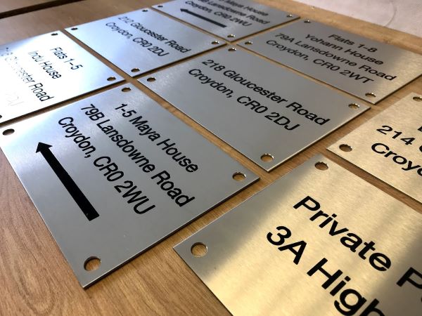 flat-number-address-plaques-on-marine-grade-brushed-stainless-steel-engraved-etched-sign-with-black-lettering-02